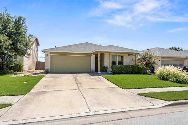 single story home featuring a garage and a front lawn