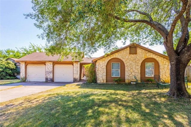 ranch-style home featuring a garage and a front lawn