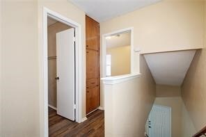 hallway featuring dark wood-type flooring