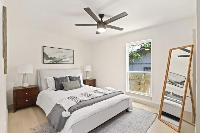 bedroom with ceiling fan and light hardwood / wood-style flooring