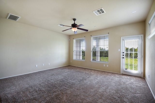 spare room with carpet and ceiling fan