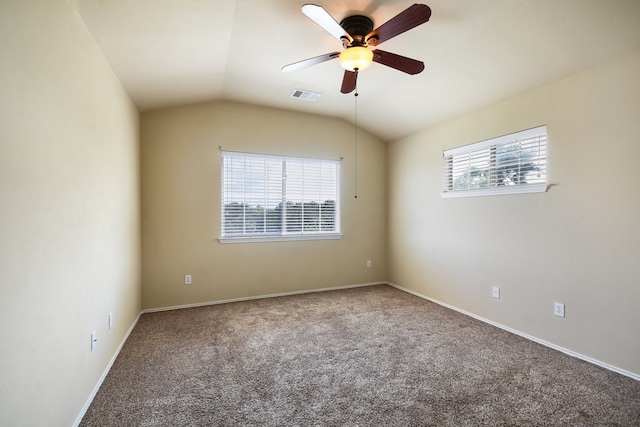 carpeted spare room with ceiling fan and lofted ceiling