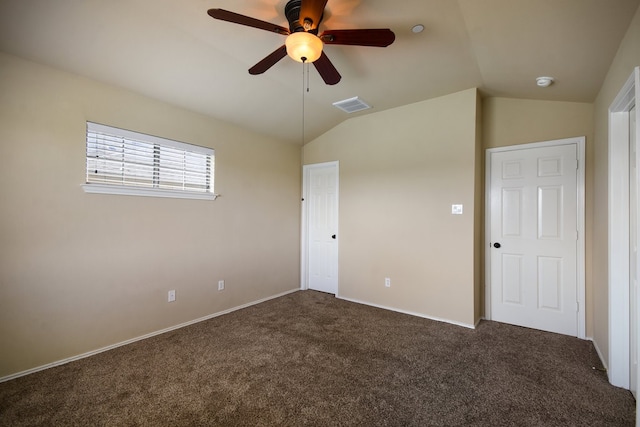 carpeted empty room featuring ceiling fan and lofted ceiling