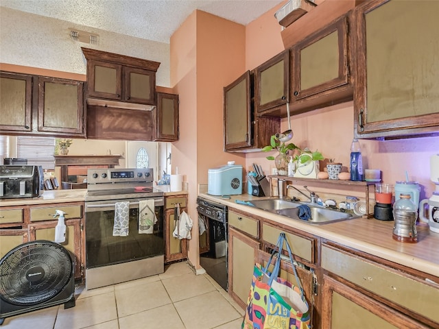 kitchen featuring light tile patterned flooring, a textured ceiling, stainless steel electric range, black dishwasher, and sink