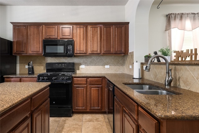 kitchen featuring sink, black appliances, backsplash, and light tile patterned floors