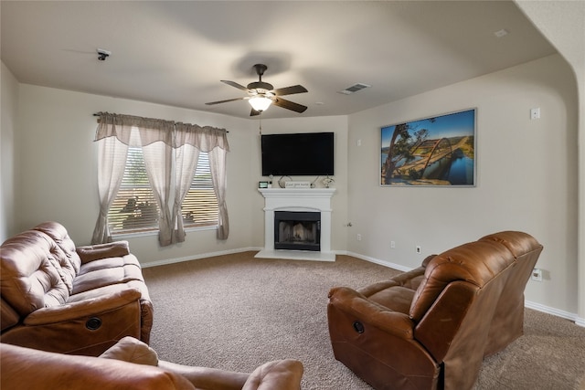 carpeted living room featuring ceiling fan