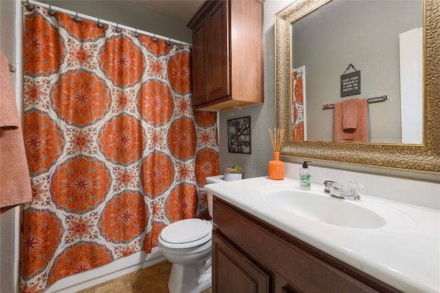 bathroom with vanity, toilet, and tile patterned flooring