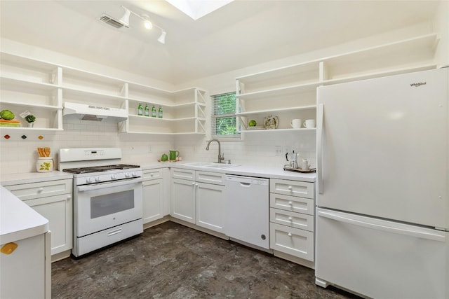 kitchen with rail lighting, wall chimney exhaust hood, white appliances, sink, and backsplash