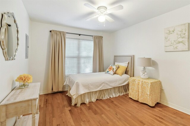 bedroom with wood-type flooring and ceiling fan