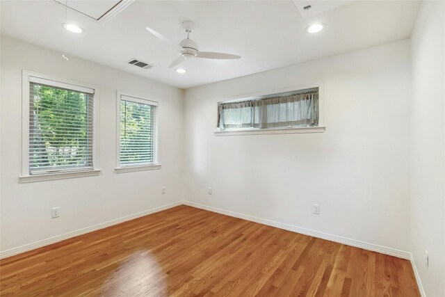 spare room with wood-type flooring and ceiling fan