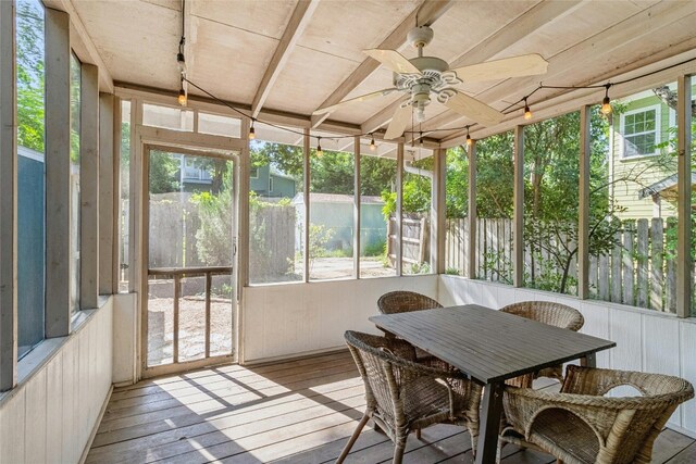 sunroom featuring wooden ceiling and ceiling fan