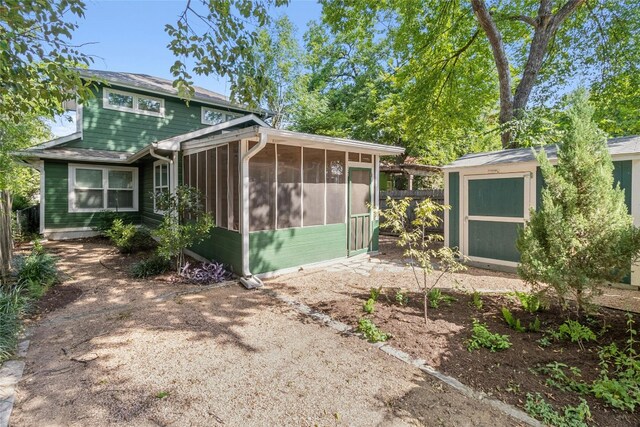 exterior space featuring a sunroom