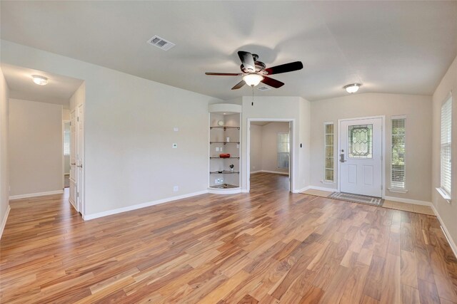 entrance foyer featuring light wood-type flooring, ceiling fan, and vaulted ceiling