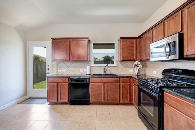 kitchen with sink, light tile patterned flooring, black appliances, and tasteful backsplash