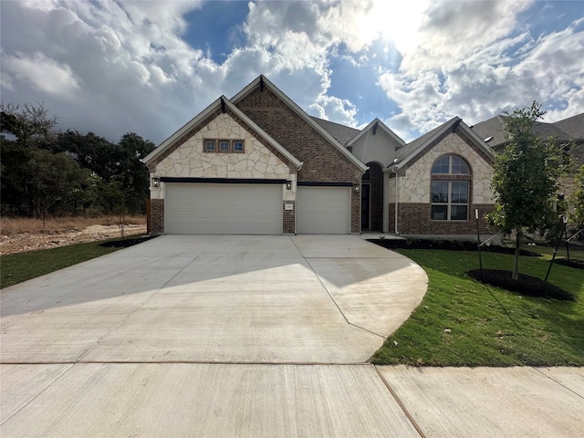 view of front facade with a front lawn and a garage