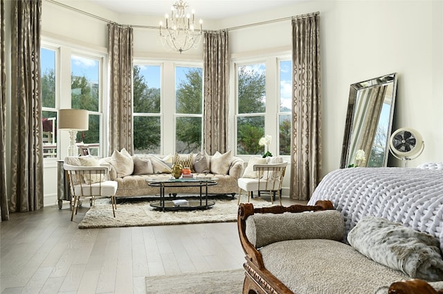 14132 Flat Top Ranch Rd, Austin, TX 78732 - bedroom with a chandelier and wood-type flooring