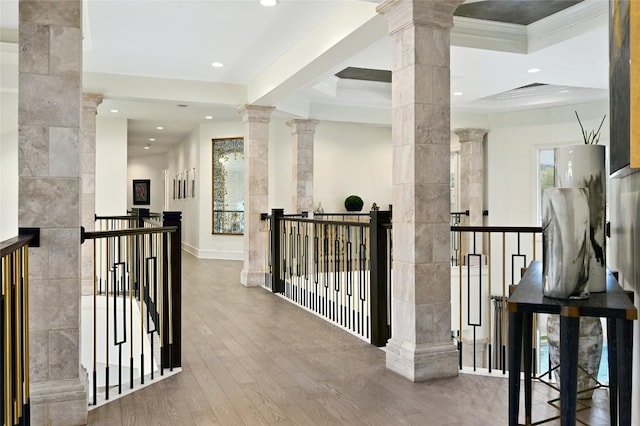 14132 Flat Top Ranch Rd, Austin, TX 78732 - hallway with decorative columns, an upstairs landing, wood finished floors, recessed lighting, and crown molding
