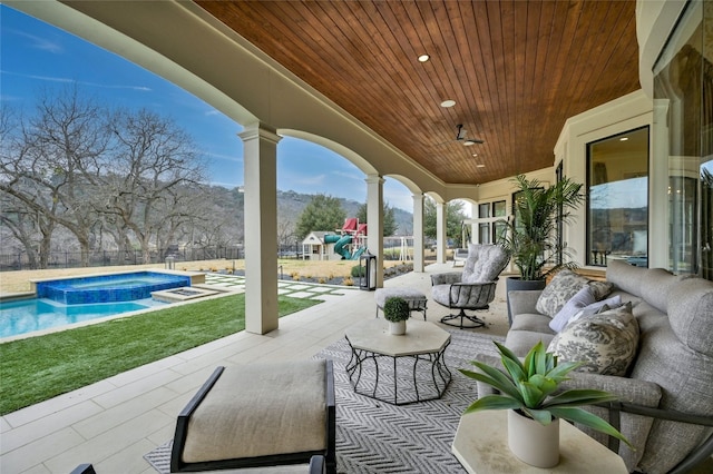 14132 Flat Top Ranch Rd, Austin, TX 78732 - view of patio with an in-ground hot tub, a mountain view, and outdoor lounge area