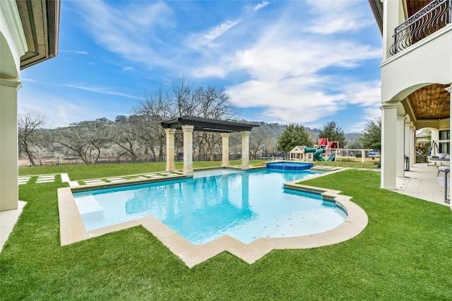 view of swimming pool with an in ground hot tub, a pergola, and a lawn