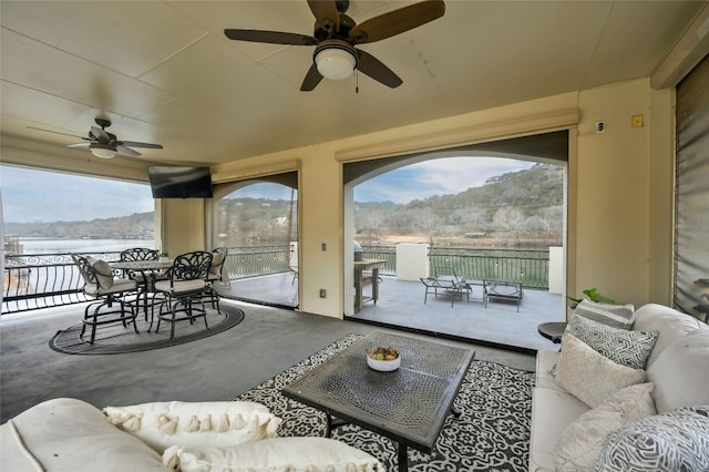 14132 Flat Top Ranch Rd, Austin, TX 78732 - living room featuring a ceiling fan and concrete floors