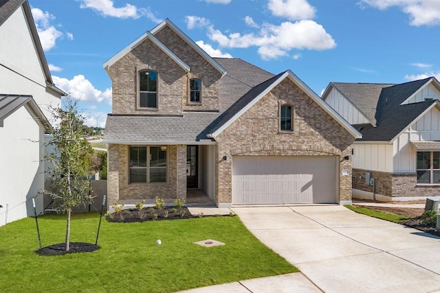 view of front facade featuring a garage and a front lawn