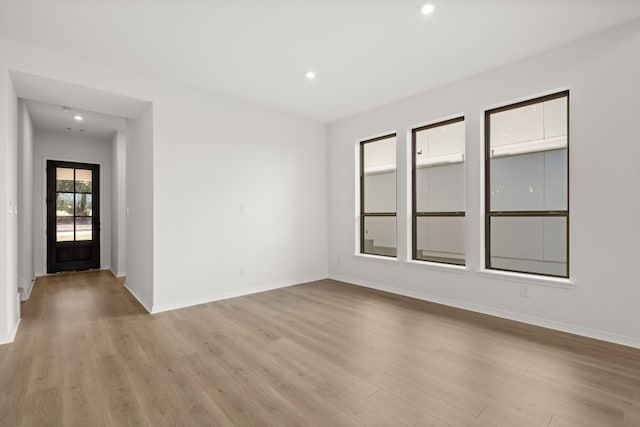 unfurnished room featuring light hardwood / wood-style floors