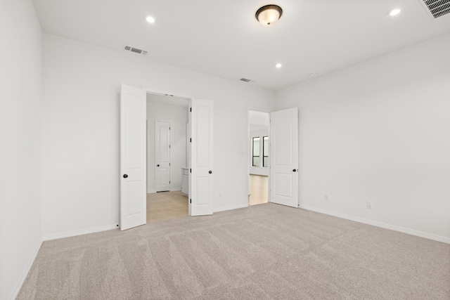 unfurnished bedroom with light carpet