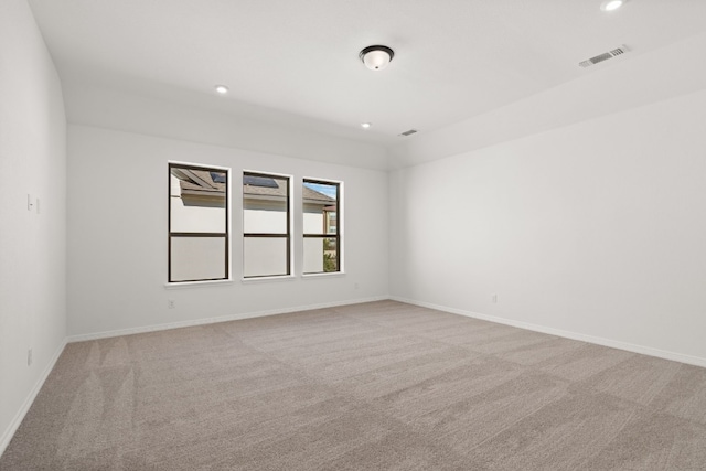 empty room featuring light colored carpet