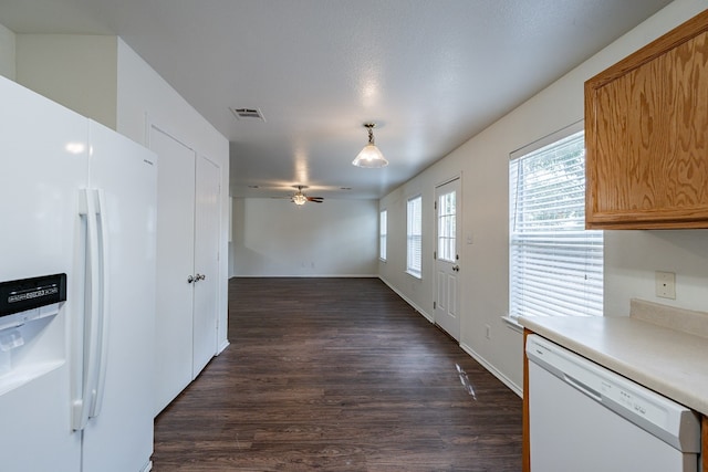 kitchen with ceiling fan, pendant lighting, white appliances, and dark hardwood / wood-style flooring