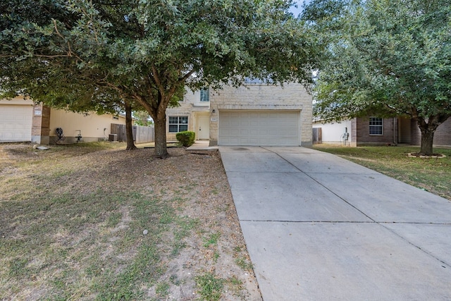 view of front facade with a front yard and a garage