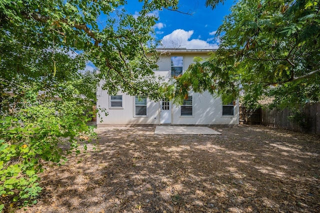 rear view of house featuring a patio