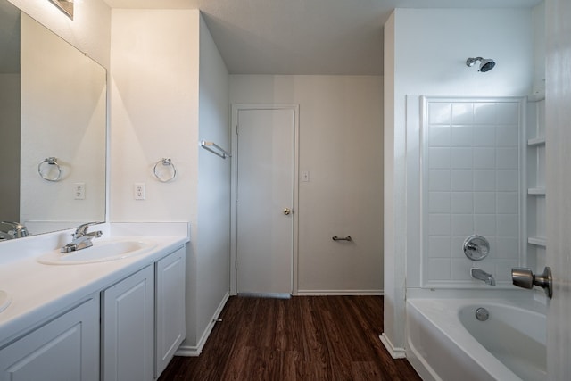 bathroom with vanity, bathtub / shower combination, and hardwood / wood-style flooring