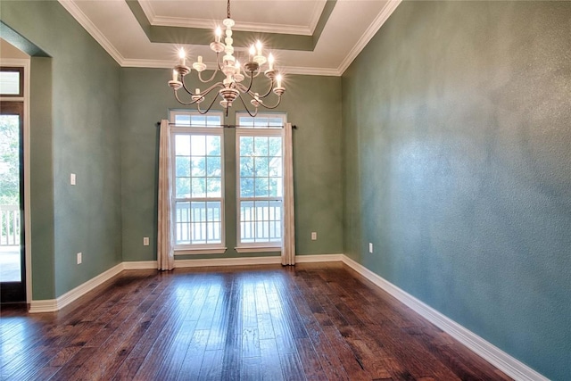 unfurnished dining area with dark hardwood / wood-style flooring, crown molding, a raised ceiling, and an inviting chandelier