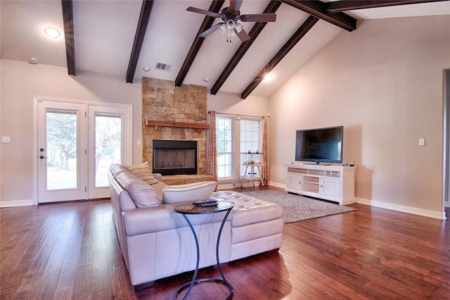 living room featuring a stone fireplace, dark hardwood / wood-style floors, ceiling fan, high vaulted ceiling, and beam ceiling