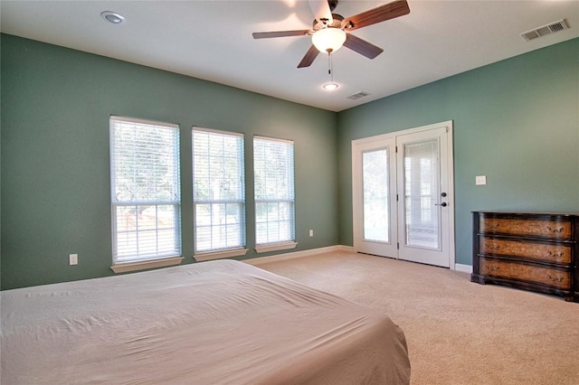 bedroom with carpet, ceiling fan, and access to outside