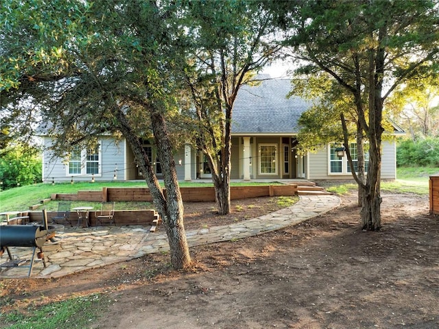 view of property hidden behind natural elements