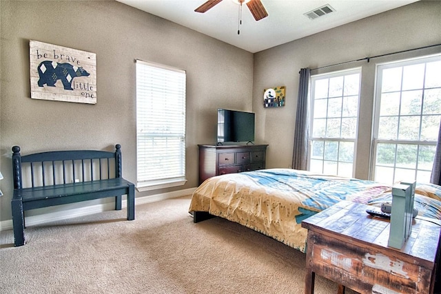 bedroom with ceiling fan and carpet flooring