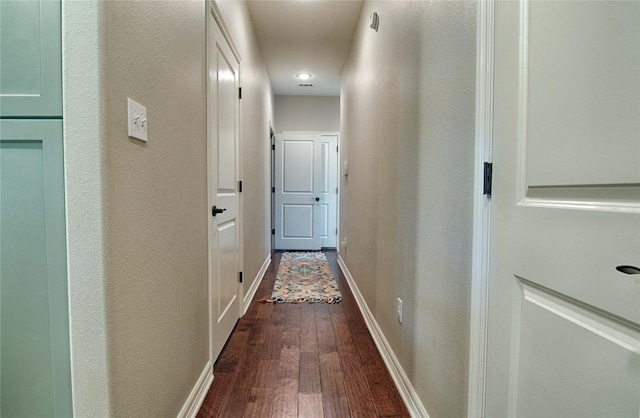 hall with hardwood / wood-style flooring