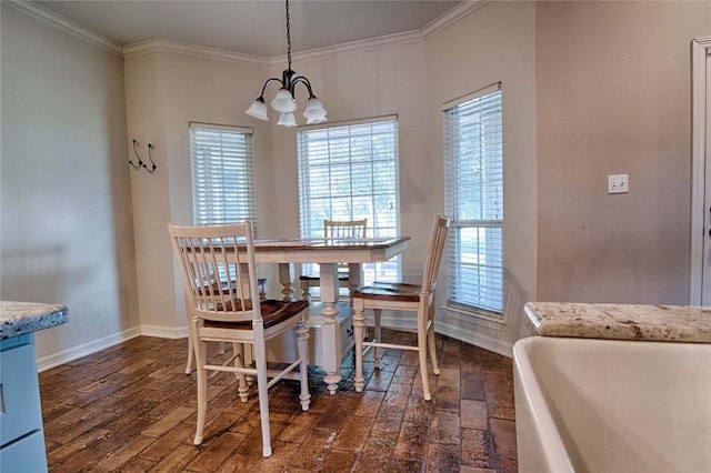 dining space with an inviting chandelier, dark wood-type flooring, and ornamental molding