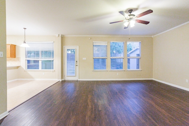 unfurnished living room featuring ceiling fan, hardwood / wood-style flooring, and crown molding