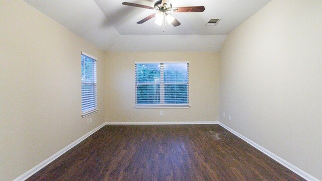 spare room with vaulted ceiling, ceiling fan, and hardwood / wood-style flooring