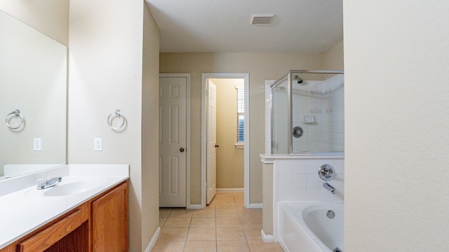 bathroom with plus walk in shower, vanity, and tile patterned floors