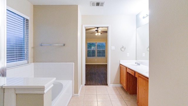 bathroom with hardwood / wood-style floors, a tub to relax in, dual bowl vanity, and ceiling fan