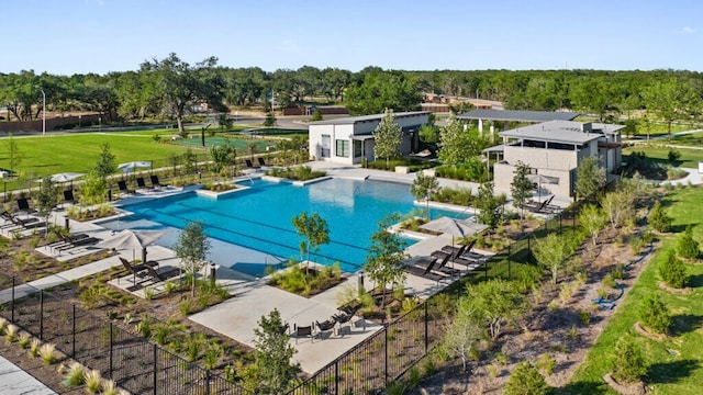 pool with fence and a patio