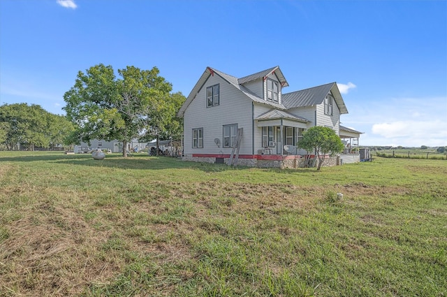 view of property exterior with a yard