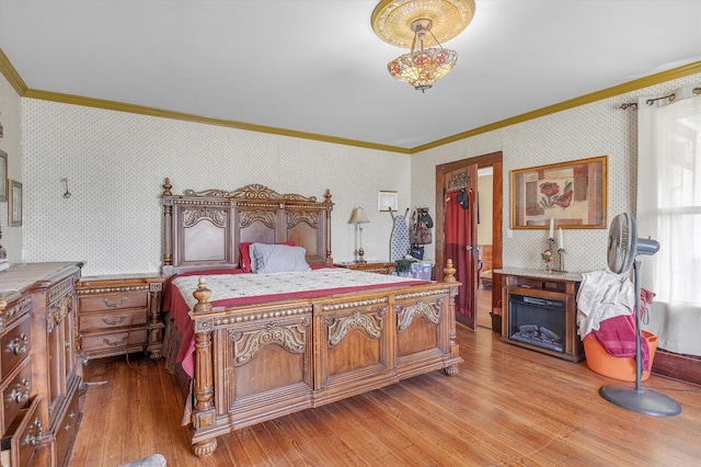 bedroom featuring wood-type flooring and crown molding