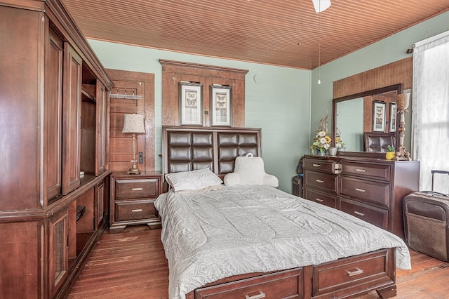 bedroom with wood ceiling and hardwood / wood-style floors