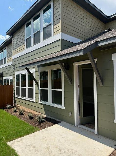 back of property featuring a patio area