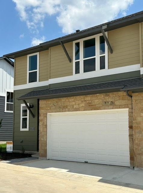 view of front of home with a garage