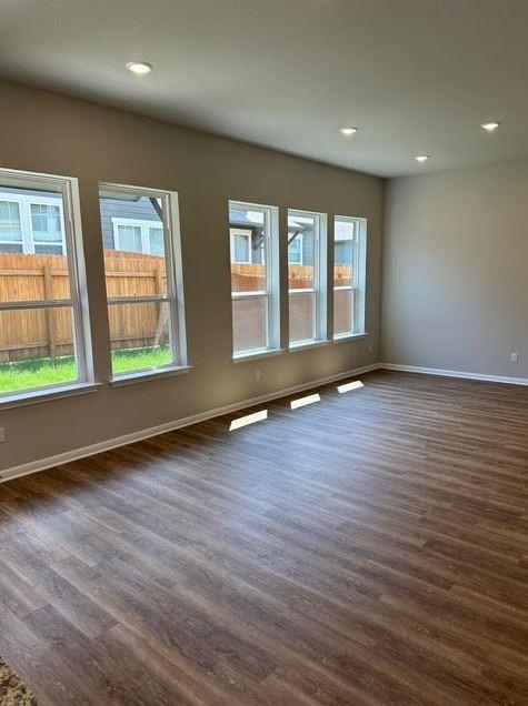 empty room featuring dark hardwood / wood-style floors